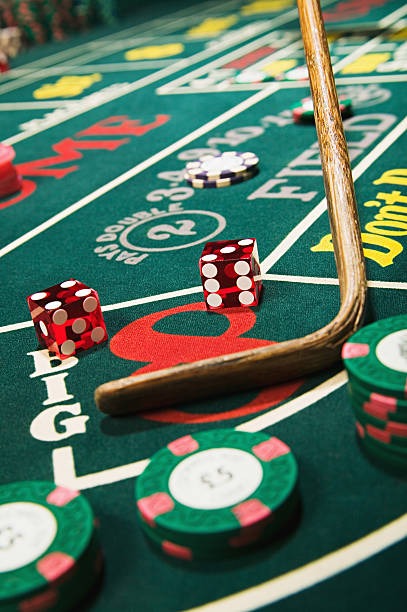 Live baccarat table with dealer and player cards displayed on merdekabet